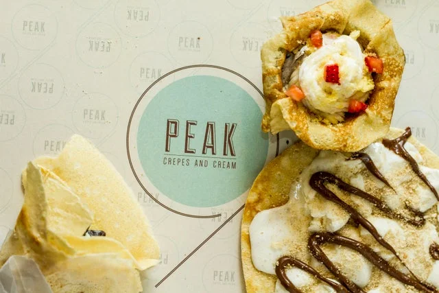 A cup of rich Colombian coffee and fresh bakery items at Peak 9