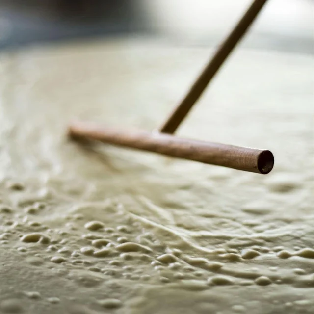 A chef making a fresh crepe at Peak 9